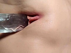 Bored, she picks at her pussy while getting double penetrated close up.