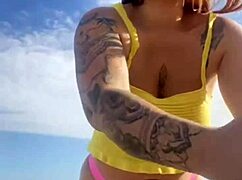 Can you see her swollen pussy lips flashing in that tiny bikini?