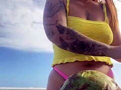 Can you see her swollen pussy lips flashing in that tiny bikini?