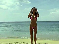 Monika Fox Poses in Pink Bikini with Stars on Beach