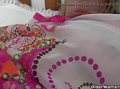 Granny with big tits gets fingered by photographer