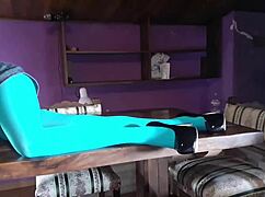 Milf in pantyhose lies on table.