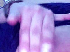 She touches herself while watching porn in her room.