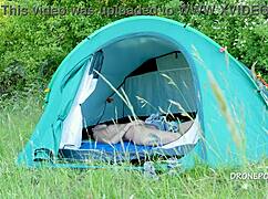 nudist milf albta relaxes in the tent at the beach