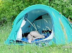 nudist milf albta relaxes in the tent at the beach