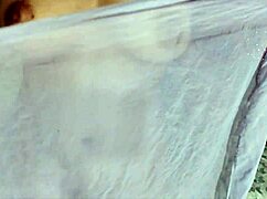 A young Indian girl enjoys attention from her brother's friend on the ranch.