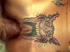 skinny blonde with pussy tattoo gets creampied on red couch