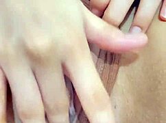 The beautiful Asian stepdaughter is spending some quiet time alone in her room, wearing shorts