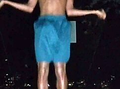 in the park, a cute brunette works out at the gym with her uncle