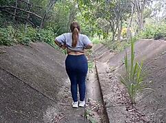 In the great outdoors, a big-boobed Latina girl flashes her tits and ass for all to see