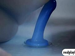 two pretty babes feeling intense pleasure with blue dildo