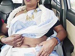 In the car, the beautiful bhabi gets romantic with her husband's brother amid dirty Telugu talks