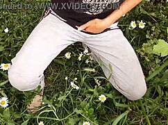 Neighbor masturbating to orgasm in outdoor daisies