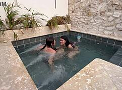 two hot lesbians masturbating in a public pool, scared of getting caught.