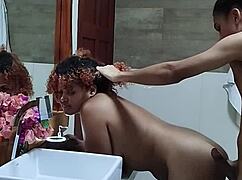 Young couple films amateur video in hotel bathroom.
