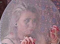 The bound individual experiences domination and urination in a bizarre fetish scene