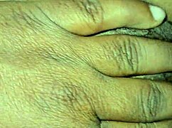 an indian girl shares a tender moment with her young dad in a homemade setting