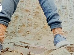 In a desi village, a woman carefully removes her saree using her finger