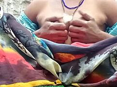 In a desi village, a woman carefully removes her saree using her finger