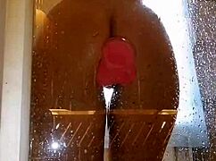 Girl with appetizing ass having fun in shower with pink dick