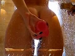 Girl with appetizing ass having fun in shower with pink dick