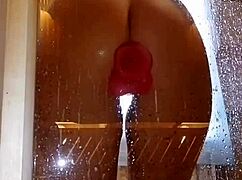 Girl with appetizing ass having fun in shower with pink dick