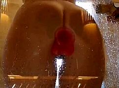 Girl with appetizing ass having fun in shower with pink dick