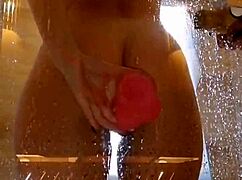 Girl with appetizing ass having fun in shower with pink dick