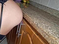 Hot maid gets horny cleaning kitchen and fingers pussy to orgasm!