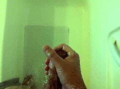 she strokes her wet body in the shower till orgasm hits