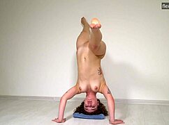 Hot curly gymnast stretches nude on sofa!