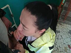 Brunette teen girlfriend sucks huge cock on public staircase swallowing cum mouthful