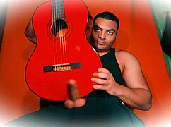 check this sexy bodybuilder stroking his huge 18cm cock guitar-style till he cums