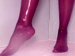 Nylon feet tease wet in steamy shower play