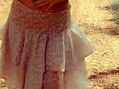 wifey lifts shirt flashing her bare milf tits outdoors