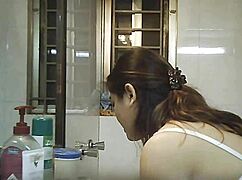 Hidden camera spies on busty Indian BBW shower bathing solo