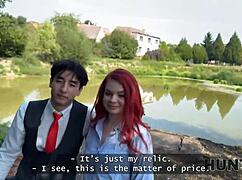 Slutty redhead Miss Olivia tempts producer with natural tits and body on public street