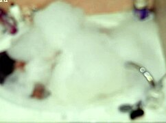 solo guy enjoys relaxing bubble bath in pool