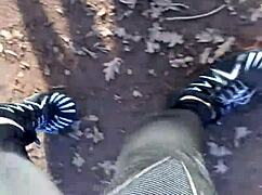 She tries on her new barefoot shoes outdoors